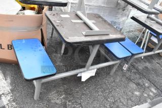 4 metal tables with 2 bench seats each, gray frames, blue benches, some wear visible, sold as 4 sets per bid.