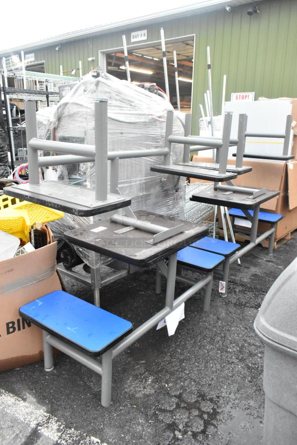 Four metal table sets with two blue bench seats, outdoor, stacked condition, suitable for commercial use.
