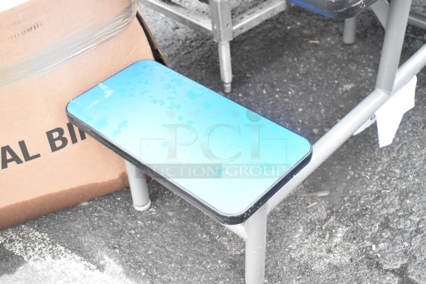 4 metal table sets with blue bench seating, light wear visible. Your bid applies to all 4 sets.
