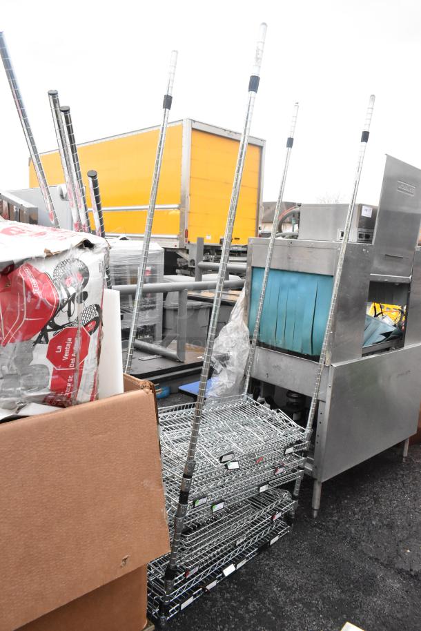 Chrome finish 5 tier wire shelving unit, dismantled; buyer responsible for dismantling and shipping.