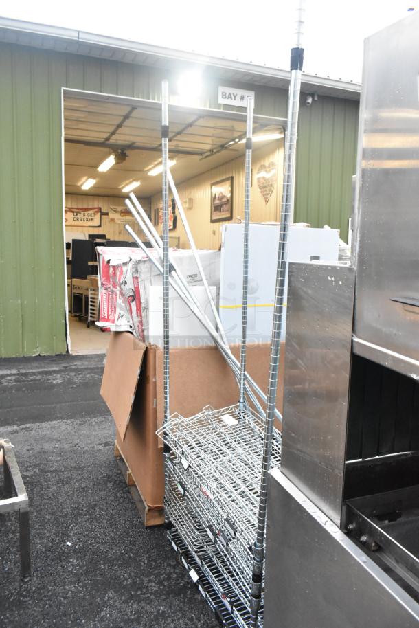 Chrome Finish 5 Tier Wire Shelving Unit, disassembled, requires buyer dismantling; condition suitable for freight.