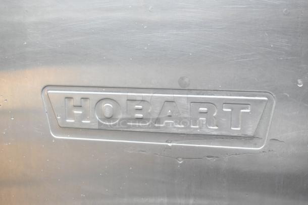 Hobart C44A stainless steel commercial conveyor dishwasher with visible branding. Model C44A, 480V, 3-phase.