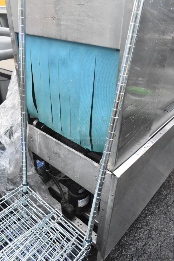 Hobart C44A stainless steel commercial conveyor dishwasher, 480V, 3 phase. Features a blue conveyor belt, sturdy build.
