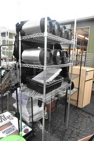 Chrome finish 3-tier wire shelving unit with 7 kegs and poly bins. Buyer must dismantle. Consider freight charges.