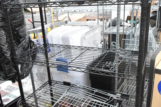 Black finish 4-tier wire shelving unit, sturdy metal, buyer dismantle required, suitable for storage and organization.