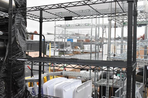 Black finish 4-tier wire shelving unit, sturdy metal construction, ideal for storage; buyer must dismantle for shipping.