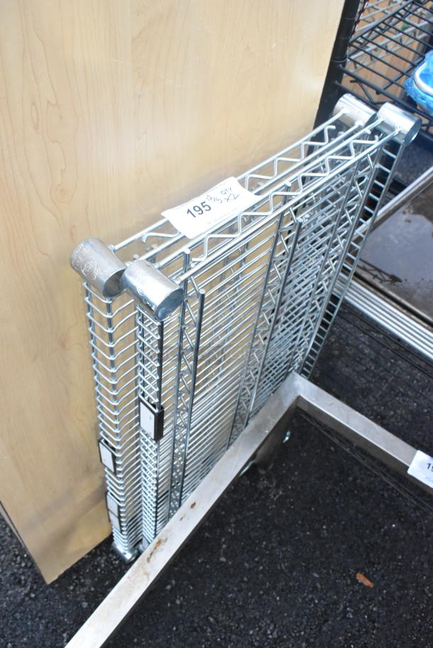 Lot of 2 chrome finish wire shelves, new condition, includes mounting brackets, approximately 19.5 inches wide.