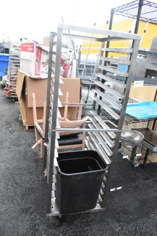 Metal Commercial Pan Transport Rack with multiple shelves, on sturdy commercial casters. Used condition.
