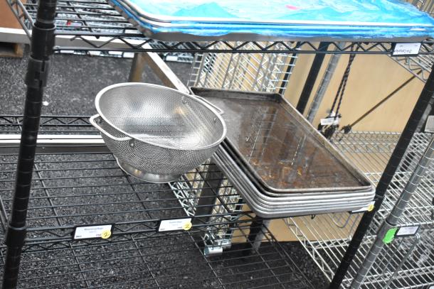 Black finish 6-tier wire shelving unit with kitchen contents, including trays and colander. Buyer to dismantle. Consider freight.