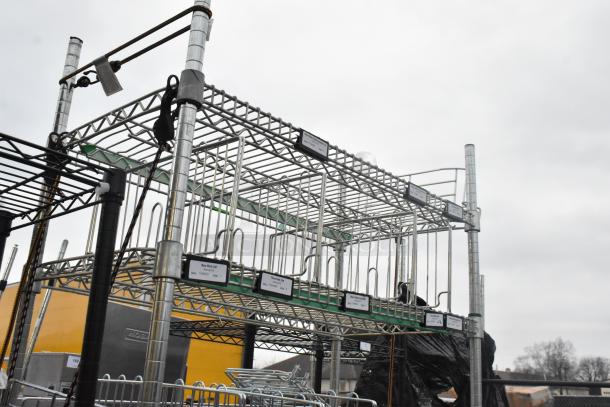 Chrome finish 6-tier wire shelving unit filled with contents; sturdy design. Buyer must dismantle. Freight charges apply.