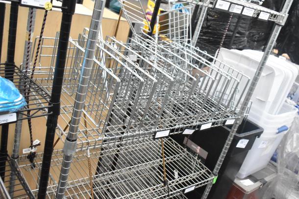 Chrome finish 6-tier wire shelving unit with contents, tags visible, buyer dismantles. Consider freight charges.