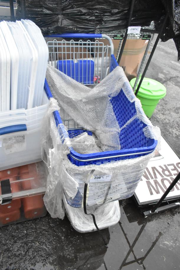 Blue shopping cart wrapped in bubble wrap. Metal frame, plastic body, and additional items around. Visible sale tag.