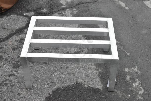 Metal Dunnage Rack, sturdy construction, rectangular frame with four legs, used condition, ideal for storage needs.