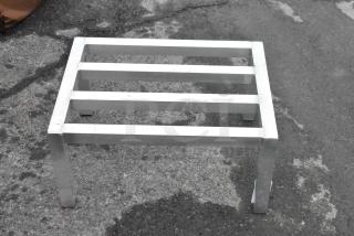 Metal Dunnage Rack, sturdy construction, rectangular frame with four legs, used condition, ideal for storage needs.