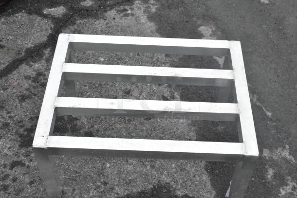 Metal Dunnage Rack, sturdy construction, silver finish, three-bar top, ideal for storage, good condition.