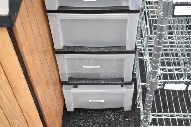 Clear and Black Poly 7 Drawer Unit, labeled "Misc Supplies," with visible dust. Features easy-glide drawers and durable build.