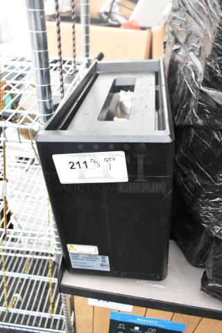 Black 1000930 Cold Brewer, rectangular shape, with label showing model and serial number. Appears lightly used.