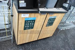 Wood-patterned trash can shell with two doors, featuring recycle and landfill markings. Good condition.