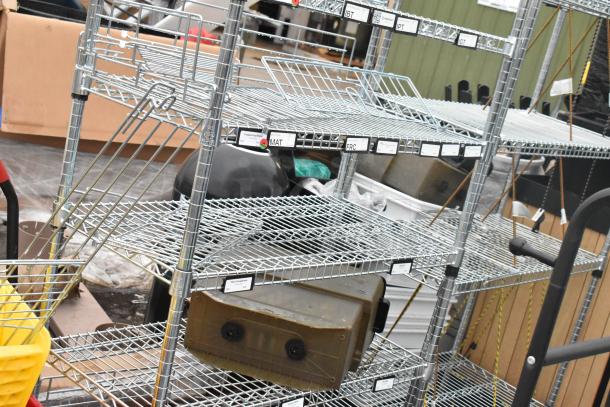 Chrome finish 8-tier wire shelving unit with labeled shelves, must be dismantled for shipping. Freight charges apply.