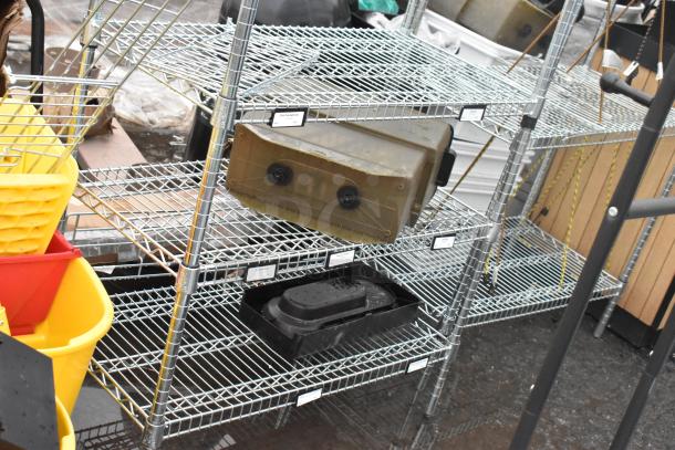 Chrome finish 8-tier wire shelving unit with visible labels. Items and bins on shelves. Buyer must dismantle.