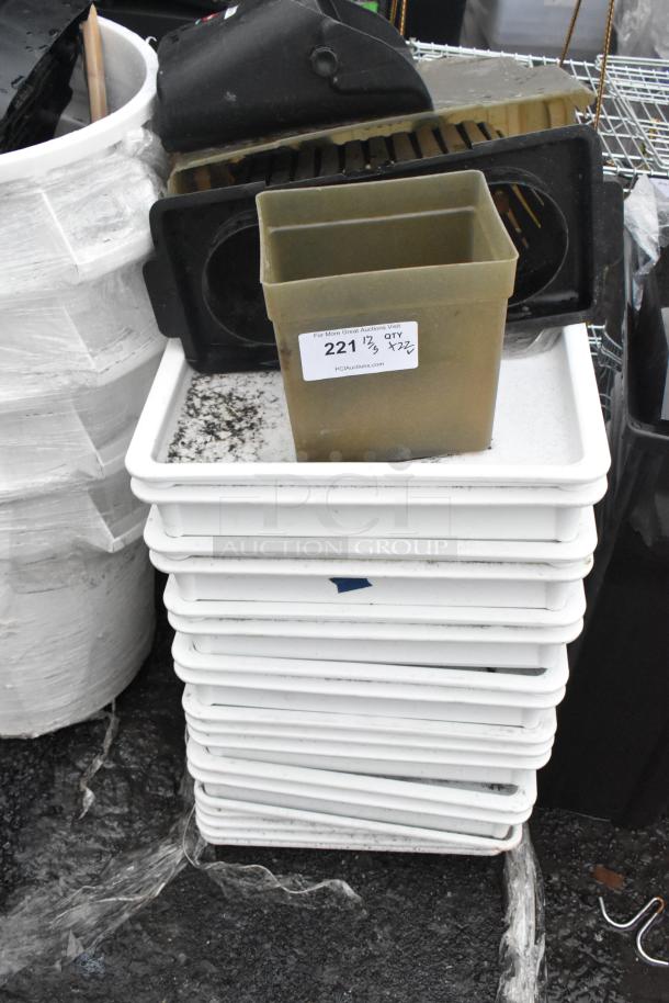 Stack of stacked poly white dough bins next to white trash cans. Tag shows qty 22. Some bins appear used.