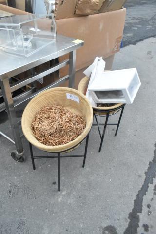 Two black metal basket stands holding straw, each with round wicker baskets. Auction tag visible, marked "137."