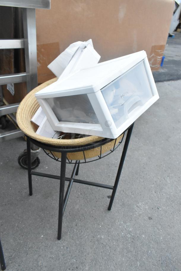 Two black metal basket stands with woven interiors, in good condition, ideal for storage or display.