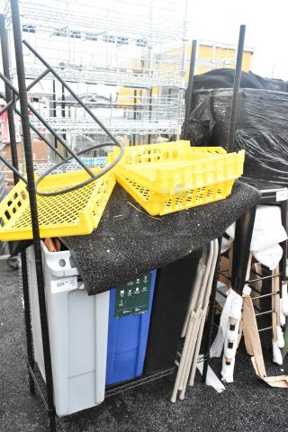 Two-tier black wire shelving unit with Slim Jim trash cans, yellow crates, and other contents. Buyer must dismantle.