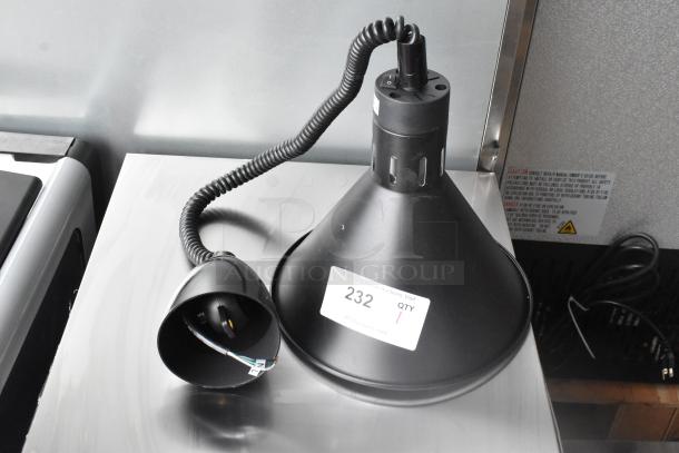 Brand new ServIt 423HLR45BK heat lamp with black round cone shade, retractable cord, minor cosmetic scratch, 120V, 1 phase.