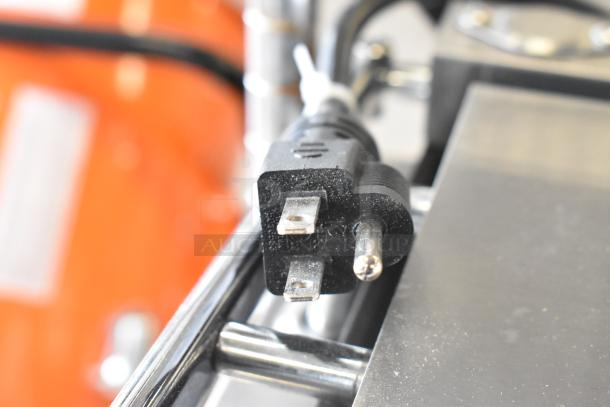 Alt text: Power plug of Avantco 177PG100ST Stainless Steel Panini Grill, smooth plates, 8 1/2" x 8 1/2" surface, 120V.