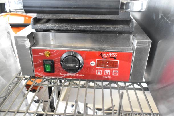 Avantco 177PG100ST stainless steel panini grill, scratch and dent condition, with timer, smooth plates, 8.5"x8.5" cooking surface.