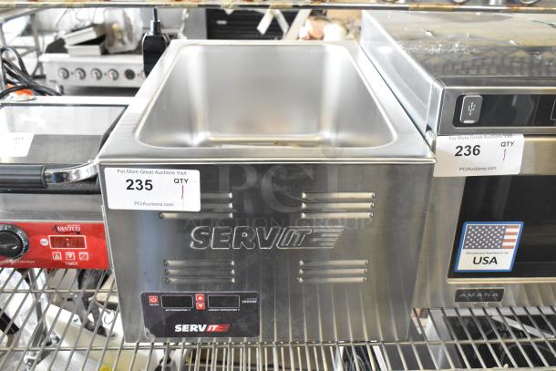 Brand new ServIt 423FW150 stainless steel electric countertop food warmer, 12"x20", digital controls, 120V, label "235 QTY 1".