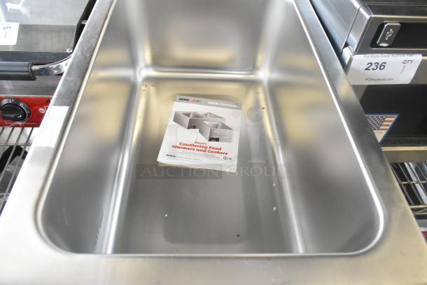 New ServIt 423FW150 stainless steel electric food warmer, 12"x20". Features digital controls. Includes user manual. Some dents.