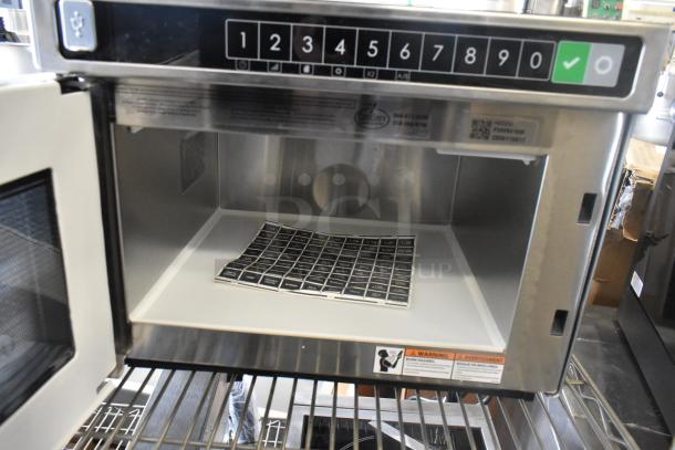 Brand new 2025 Amana HDC212 stainless steel commercial microwave, 208/240V, with keypad, interior view.