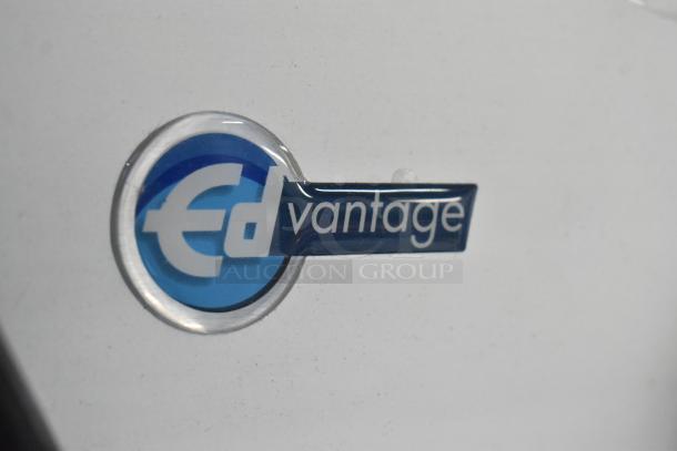 Edlund EDVG-12A electric meat grinder logo, blue and white text on stainless steel. 2022 model, 120V, scratch and dent.