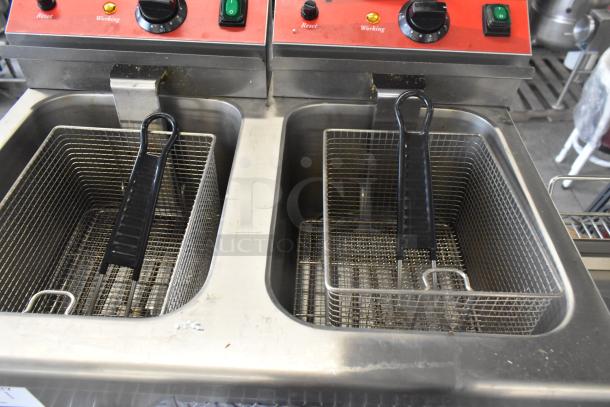 Brand new Avantco 177F202 stainless steel dual-tank electric fryer with two metal baskets, slight scratches visible. 208-240V.