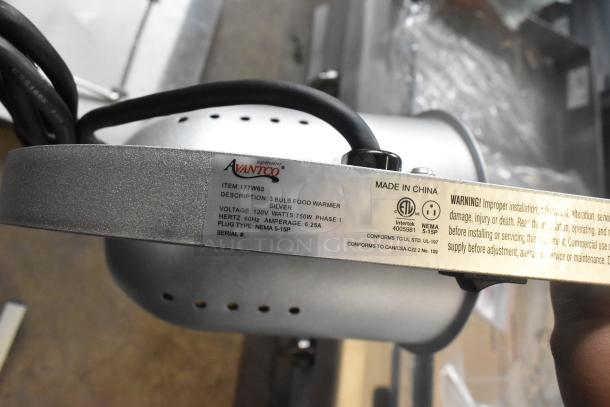 Avantco 177W63 free standing heat lamp, 3 bulbs, T-legs. New condition, label shows 120V, 750W, NEMA 5-15P plug.