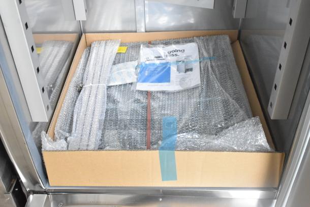 Brand new Avantco 178SS1RHC stainless steel commercial cooler with bubble-wrapped poly coated racks.