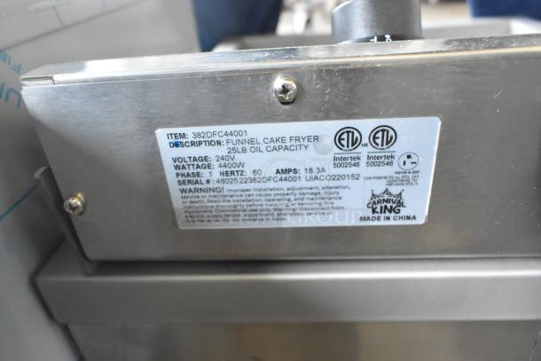 Brand new Carnival King 382DFC44001 stainless steel funnel cake/donut fryer, 25 lb capacity, 240V, 1 phase, with label.