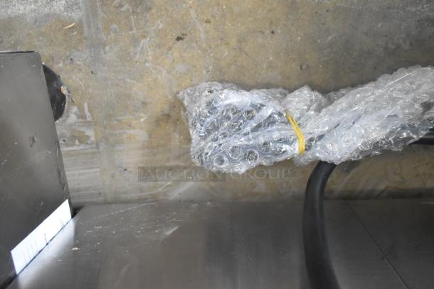 Carnival King 382DFC44001 stainless steel fryer, new condition, visible cable in bubble wrap, minor dents shown.