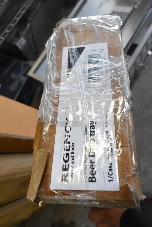 "Regency 30-inch stainless steel beer drip tray with rinser, new with scratch and dent, in original packaging."