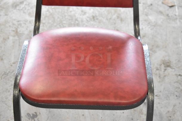 Stackable Flash Furniture banquet chair, burgundy vinyl, trapezoidal back, silver vein frame, 1.5" cushion, new condition.