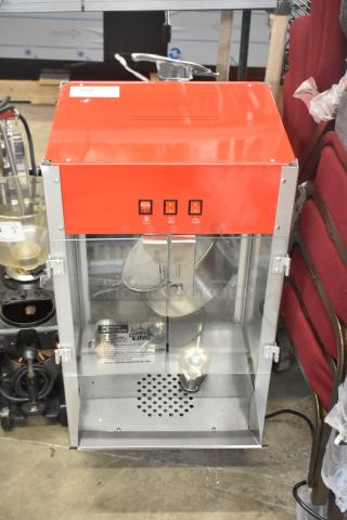 Brand new Carnival King PM1360 12 oz. popcorn machine, red finish, scratch and dent condition, 120V, 1 phase, commercial use.