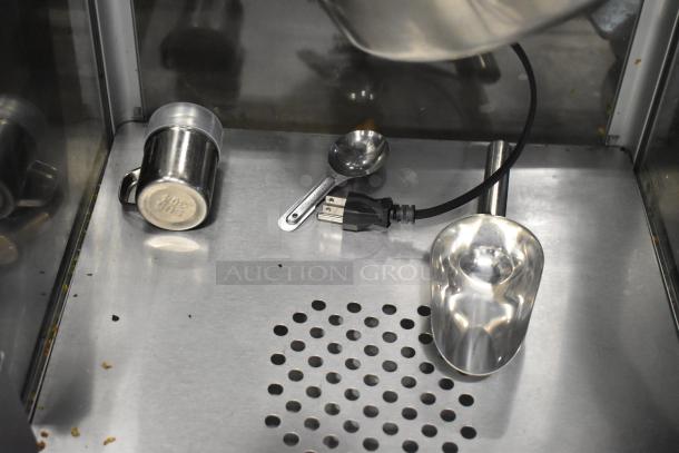 Carnival King PM1360 commercial popcorn machine, 12 oz. capacity, brand new with minor scratches, includes utensils shown.