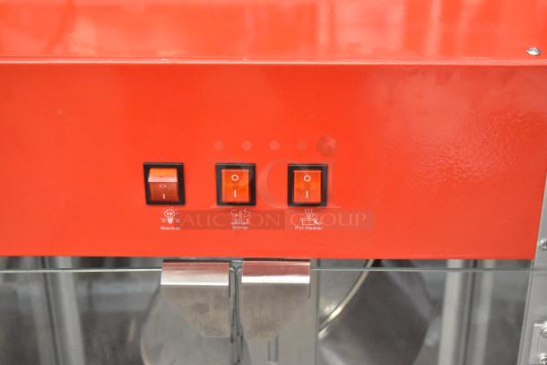 Carnival King PM1360 12 oz. popcorn machine controls; red panel, three switches for warmer, stirrer, and pot heater.