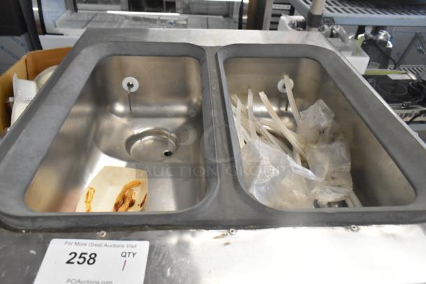 Taylor 754-27 soft serve ice cream machine showing stainless steel bins and tubes. Includes auction lot label number 258.