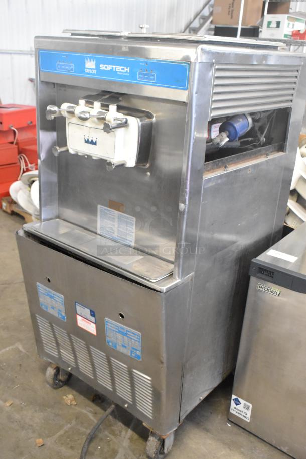 Taylor 754-27 stainless steel 2-flavor with twist soft serve machine, air-cooled, on commercial casters. 208-230V, 1 phase.