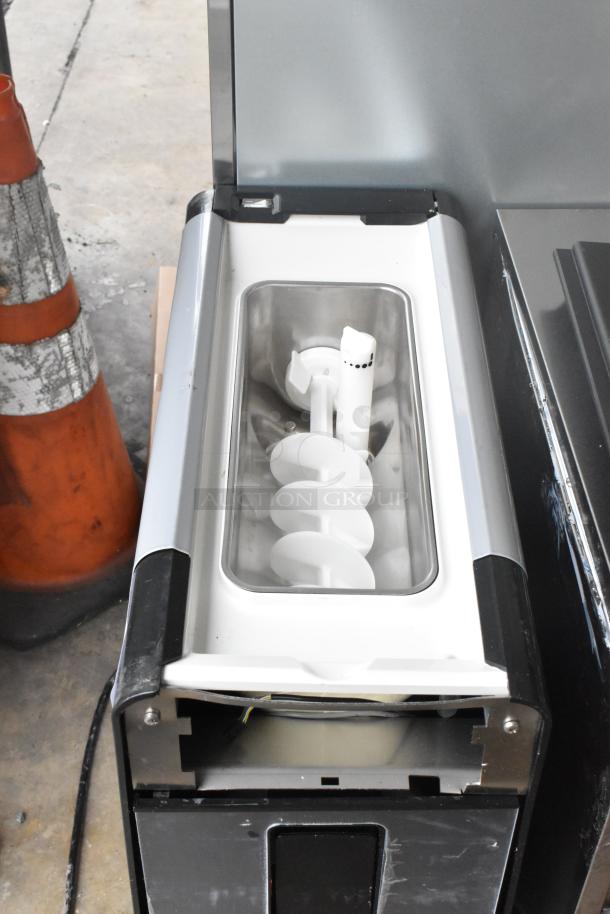 Brand new Stoelting C111-37 soft serve machine, 115V, gravity-fed, single flavor, minor scratches, visible auger detail.