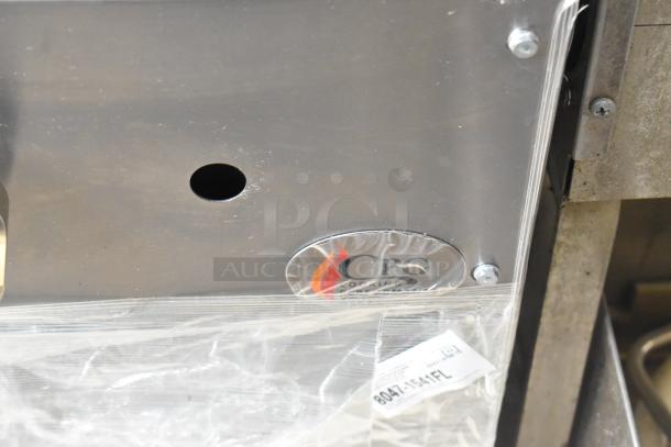 BRAND NEW SCRATCH AND DENT! Cooking Performance Group CPG-SP-18-N Natural Gas Stock Pot Range with 80,000 BTU, Model 351CPGSP18N, shown with identification label and protective cover.