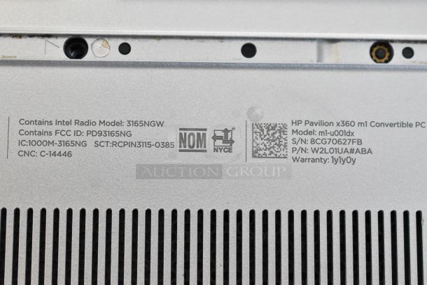 HP m1-u001dx laptop bottom label showing model, serial number, and warranty info. Includes FCC ID and Intel Radio details.
